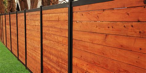 wooden fence with metal posts